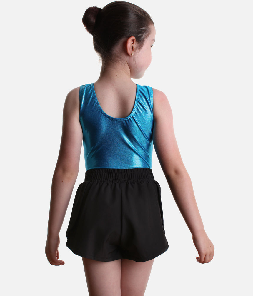 Back view of Roch Valley double layered black shorts, showing the wide gathered waistband and loose outer shape.