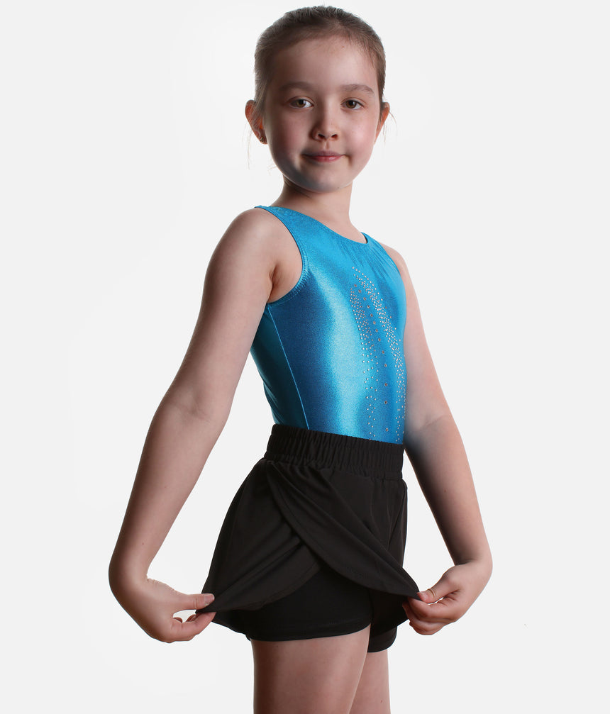 Roch Valley double layered black shorts worn over a leotard, with the curved outer layer lifted to show the closer inner shorts.