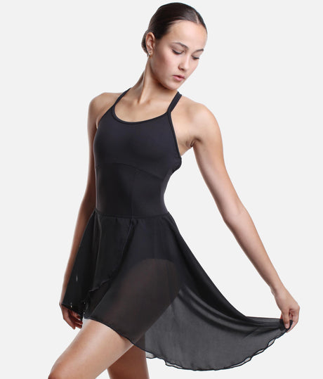 Intermezzo 7799 black chiffon ballet skirt with a crossed front, elastic waistband and flowing long back, worn with a white tank leotard.