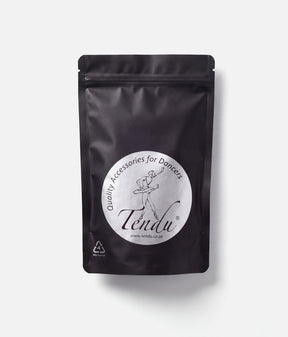 Front of a black resealable Tendu Rock Rosin pouch with a round white ballerina logo label on a white background.