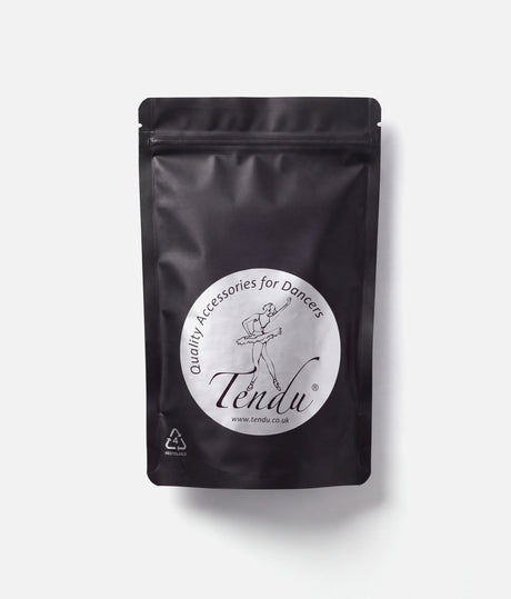 Front of a black resealable Tendu Rock Rosin pouch with a round white ballerina logo label on a white background.