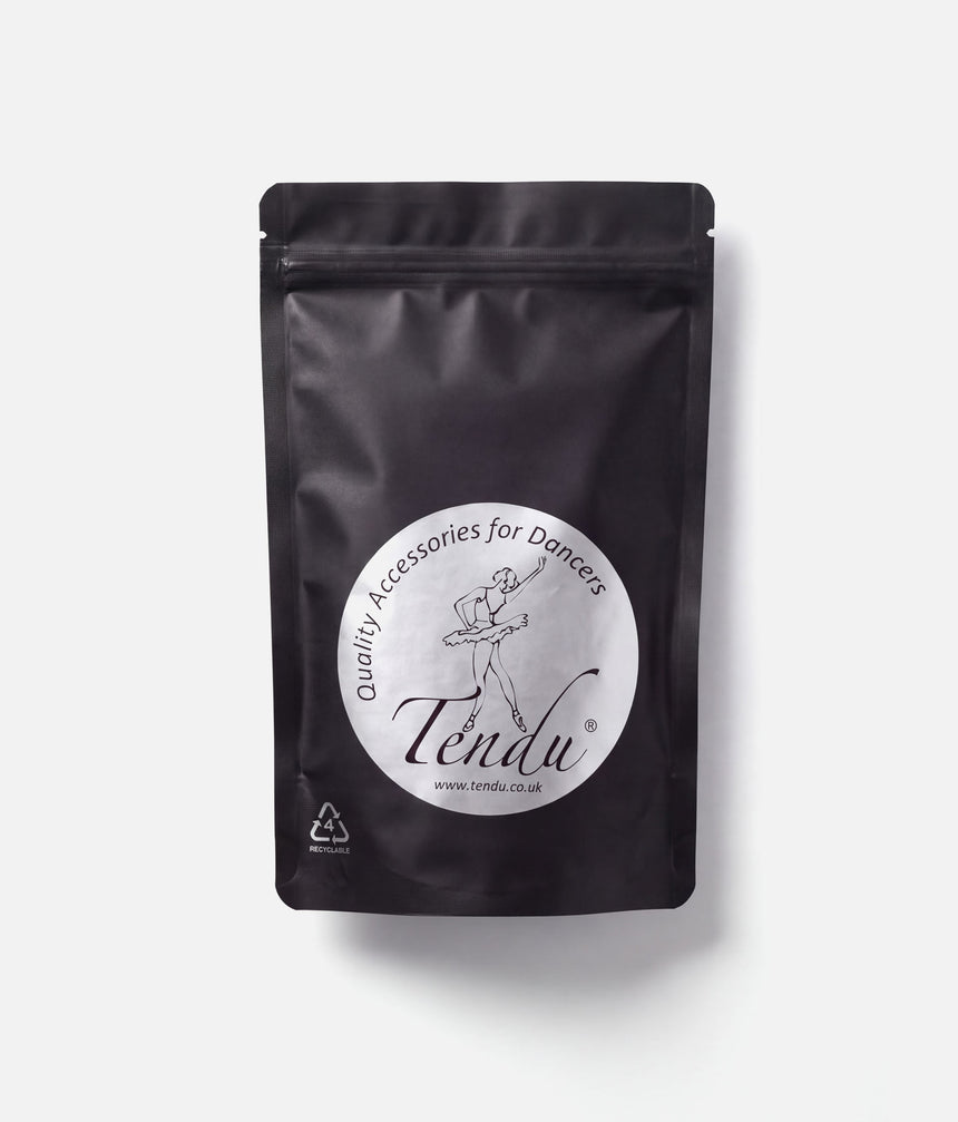Front of a black resealable Tendu Rock Rosin pouch with a round white ballerina logo label on a white background.