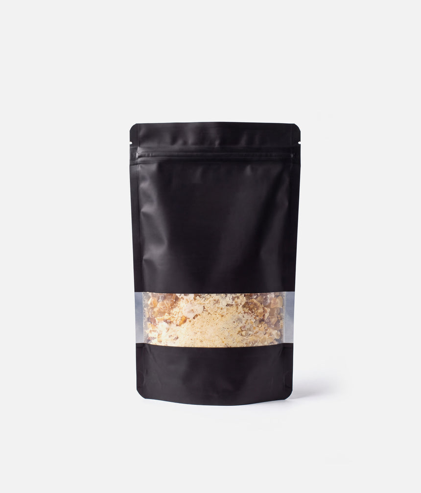 Tendu Rock Rosin pouch showing amber rosin pieces and fine powder through the clear window.