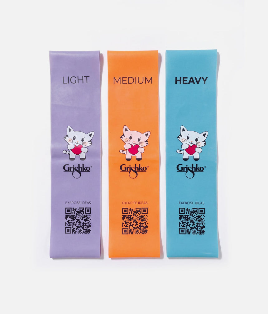 Three Grishko brand resistance bands in light purple, orange, and light blue, labeled LIGHT, MEDIUM, and HEAVY, with cartoon cat graphics and QR codes on a white background.