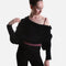 Black Mirella Adagio warm-up scarf worn as a cropped bolero, showing long sleeves and a twisted drape over a plum leotard.