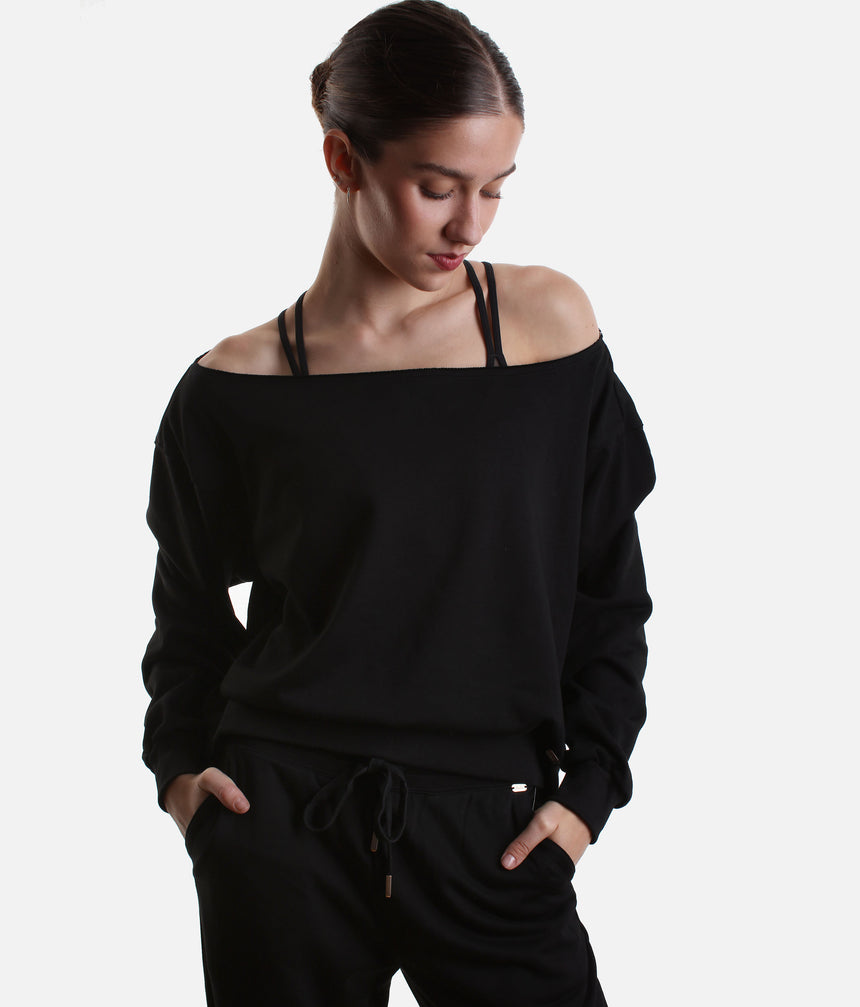 Mirella Adagio M30019L sweatshirt in Black, worn off one shoulder with long sleeves and matching wide leg sweatpants.