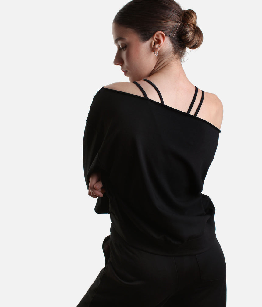 Mirella Adagio M30019L sweatshirt in Black, worn off one shoulder with long sleeves and matching wide leg sweatpants.