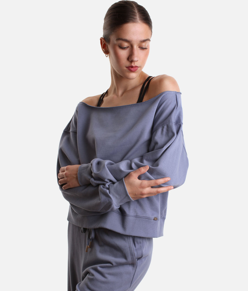 Mirella Adagio M30019L sweatshirt in Dusty Grey, worn off one shoulder with long sleeves and matching wide leg sweatpants.