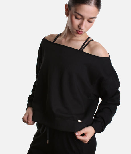 Mirella Adagio M30019L sweatshirt in Black, worn off one shoulder with long sleeves and matching wide leg sweatpants.