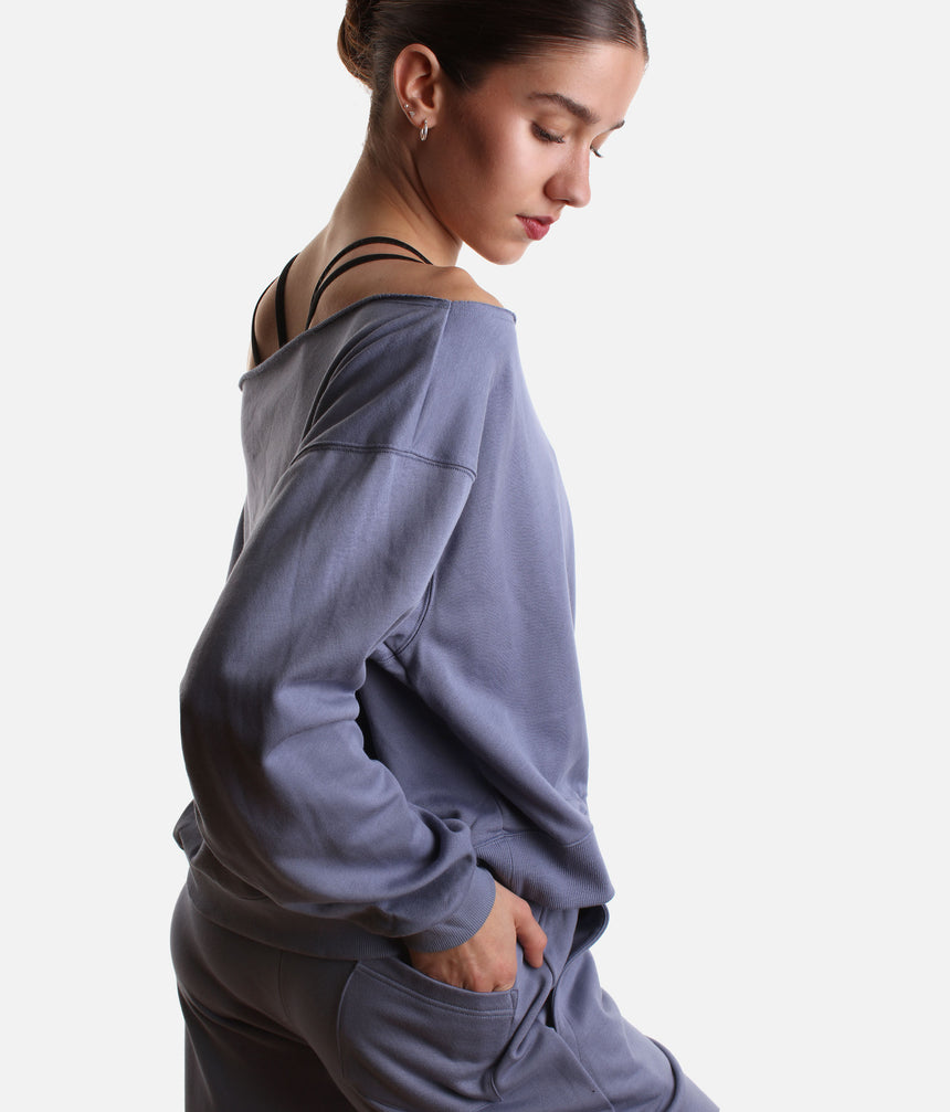 Mirella Adagio M30019L sweatshirt in Dusty Grey, worn off one shoulder with long sleeves and matching wide leg sweatpants.