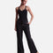 Angled view of Mirella Adagio M80007L sweatpants in Black, showing the drawstring waist, front pocket and full-length wide legs.