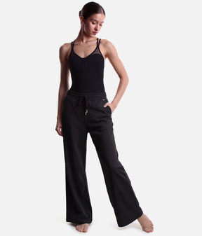 Angled view of Mirella Adagio M80007L sweatpants in Black, showing the drawstring waist, front pocket and full-length wide legs.