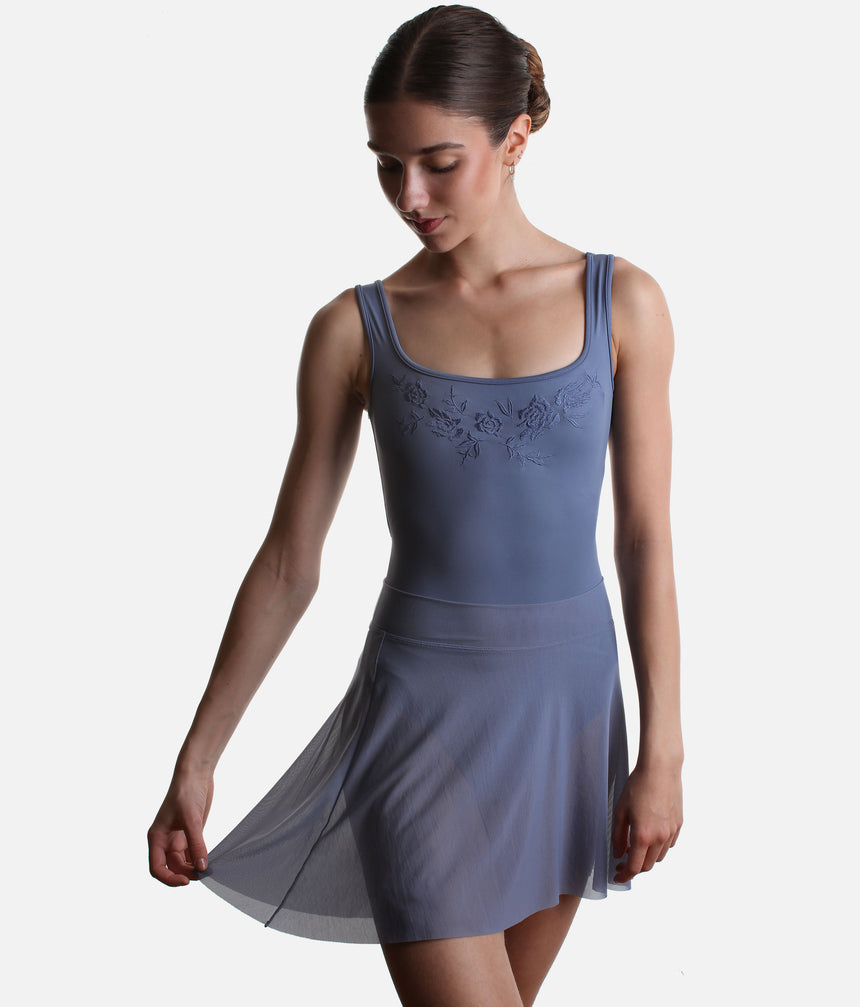 Mirella Adagio MS10005 mesh skirt in Dusty Grey, held out at one side over a matching floral tank leotard.