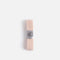 Flat view of pale pink Tendu thick pointe shoe elastic showing its solid textured surface and silver branded band.